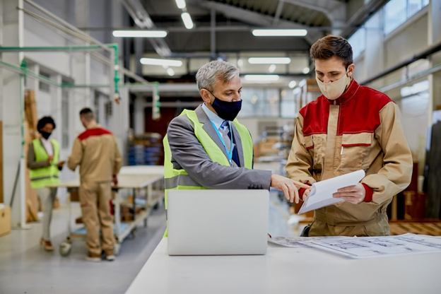 Facility manager using tablet to manage maintenance